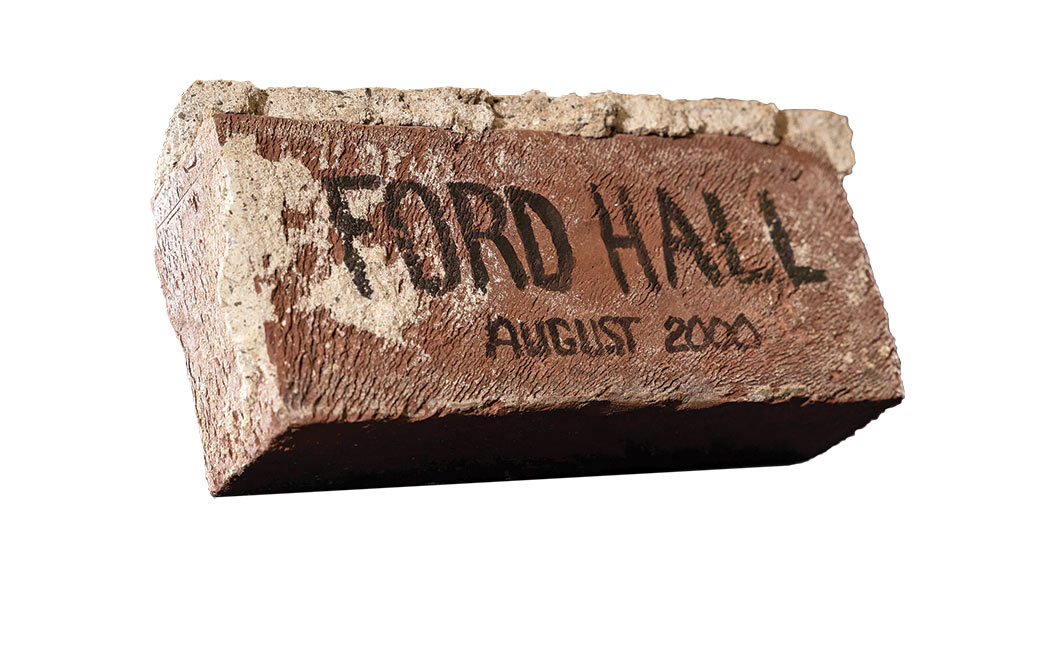 A brick inscribed "Ford Hall / August 2000"
