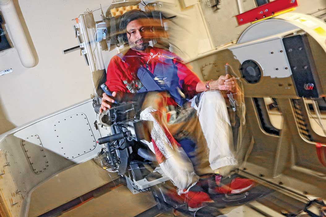 A motion-capture image of someone sitting in a chair that is moving.