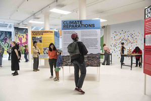 climate pop up exhibit with people looking at it