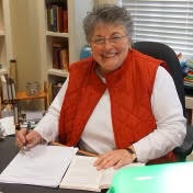 Photo of Rosann Catalano at desk