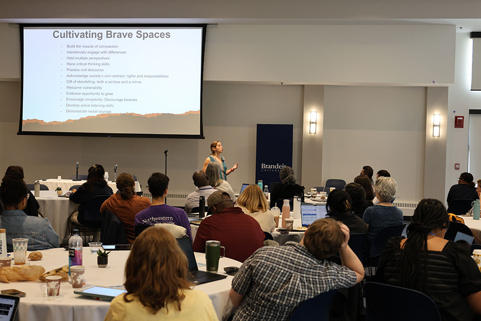 Rachel Fish, PhD, speaking with slide in background titled "Cultivating Brave Spaces"