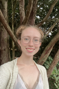 Jessy pictured standing in front of tree