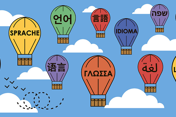 illustration of hot-air balloons aloft, each branded with a different language