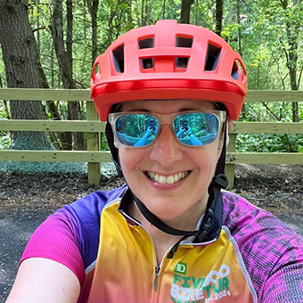 Stephanie Hunt, wearing a bicycle helmet