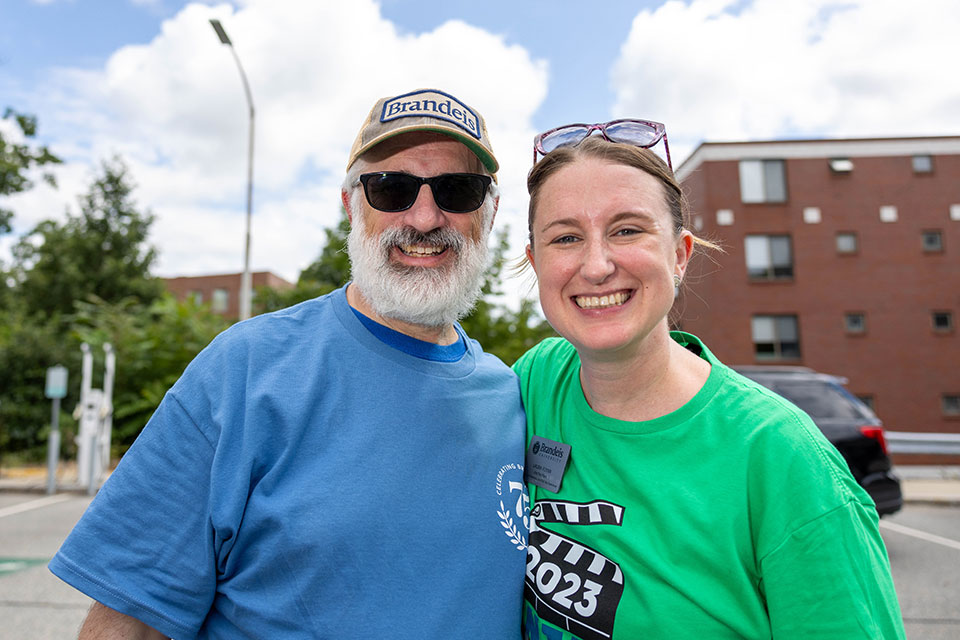 A Brandeis staff member smiles with former president of the Alumni Association.