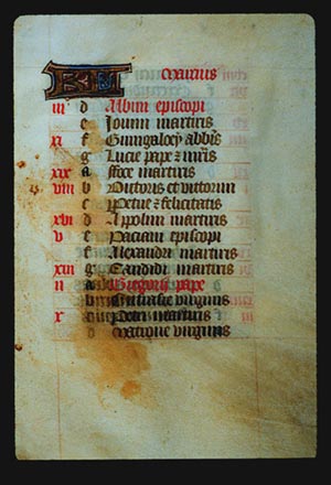 Page 3r: with a large illuminated letter and the word for March (in Latin). The rest of the page is lettered by hand with a list, each line has a red letter on the left in sequence from a - g (presumably the days of the week), and then it starts again from a.  In the left margin are some notes in red corresponding to some of the lines.