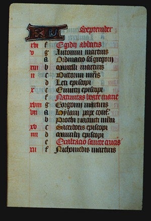 Page 9r. with a large illuminated letter and the month (September  in Latin). The rest of the page is lettered by hand with a list, each line has a red letter on the left in sequence from a - g (presumably the days of the week), and then it starts again from a. In the left margin are some notes in red corresponding to some of the lines. 