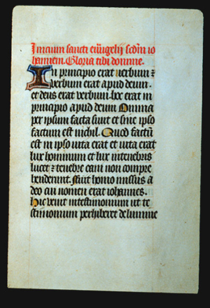 Page of black letter text with large illuminated letter "I" and the initial letter of some sentences with yellow coloring. The first two lines are inked in red letters.