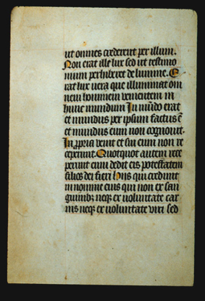 Page of hand lettered text. The counter spaces of some initial letters are colored yellow. 