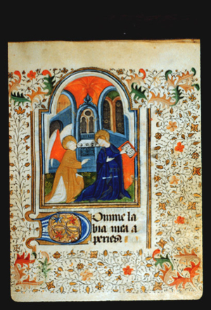 Painting on page 20r of The Annunciation. A winged angel speaking to Mary in a blue robe holding a book, with archways behind them.  The margins around the painting are filled with a painted border of achantus scrolls in red and blue, and leaf and vine patterns The leaves in the four corners are larger than the others.
