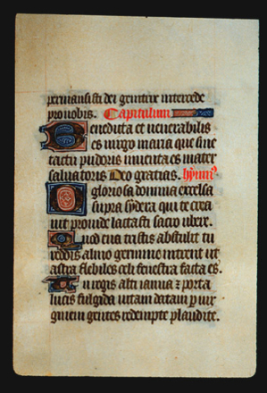 Page 37r, containing a dense block of blackletter text, with 4 illuminated initial letters.  There is also a horizontal ornament that fills the space following the end of a sentence and 2 words inked in red. 