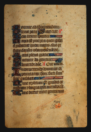Page 57r, containing a dense block of blackletter text, with 11 illuminated initial letters,  2 red word and 3 horizontal ornamental elements that fill the space from the end of a sentence to the right margin.