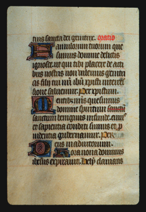 Page 59v, containing a dense block of blackletter text, with 4  illuminated initial letters,  one red word, one word with a red line through it, and several gold counterspaces.