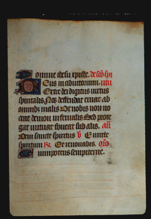 Page 64r, containing a dense block of blackletter text, with 3 illuminated initial letters and several red words and gold counterspaces.