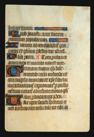 Page 69r, containing a dense block of blackletter text, with 5 illuminated initial letters, one red word, some gold counterspaces, and 2 ornaments that fill the space from the end of a sentence to the right margin. 