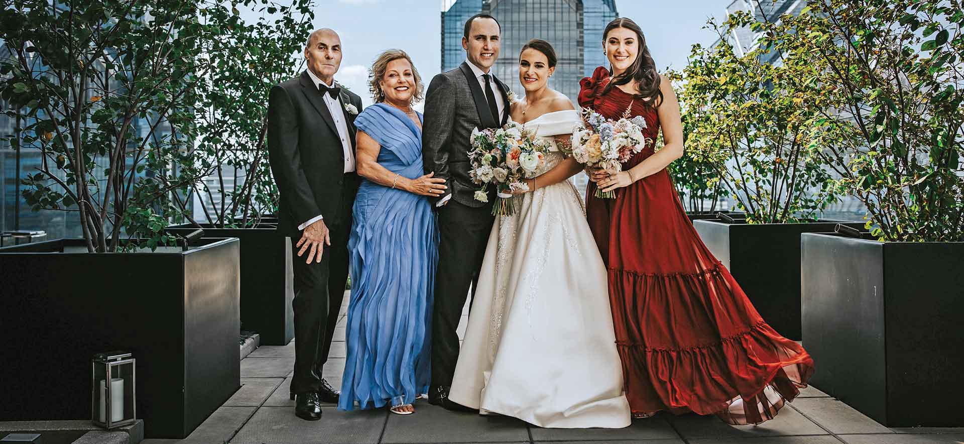 Rachel Weissman stands with her family at her wedding.