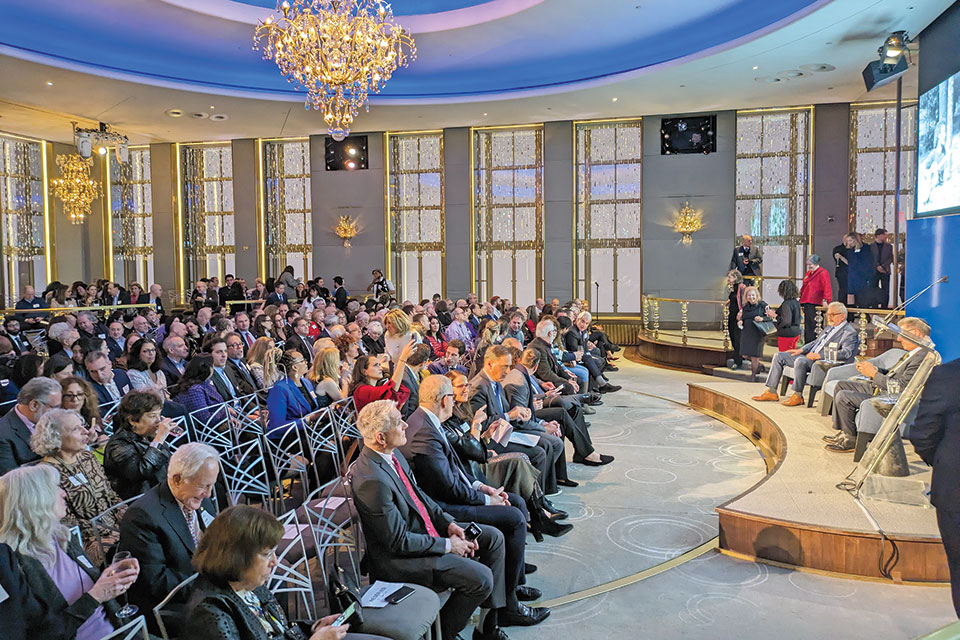 An audience sits in the Rockefeller Center Rainbow Room.
