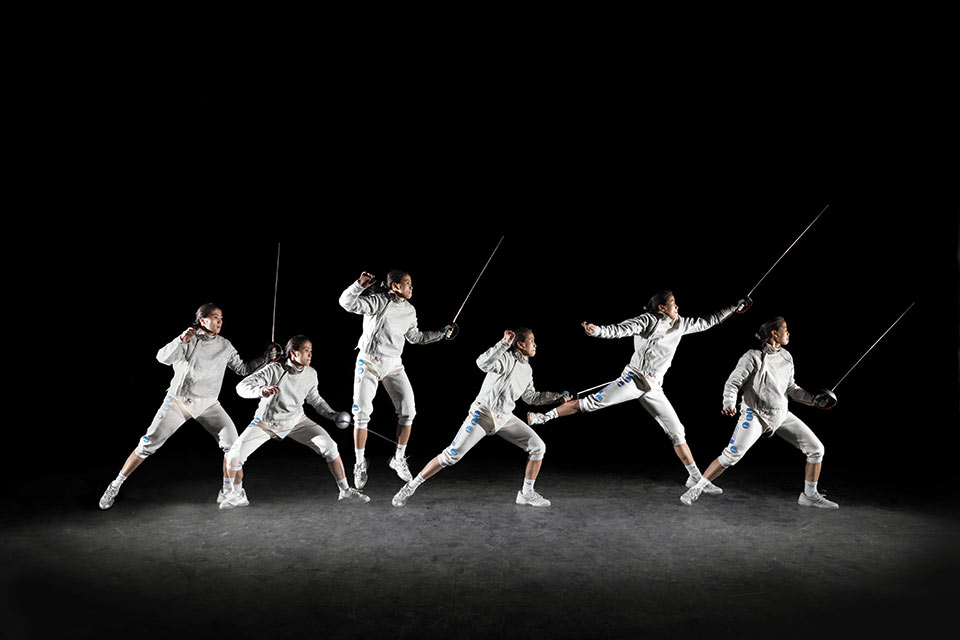 Maggie holding a sabre compiled into 6 different poses against a black background