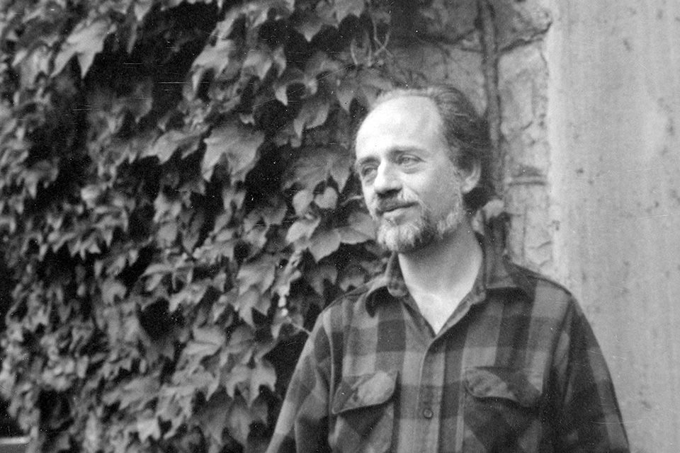 Martin Boykan in 1981 posing in front of an ivy-covered building