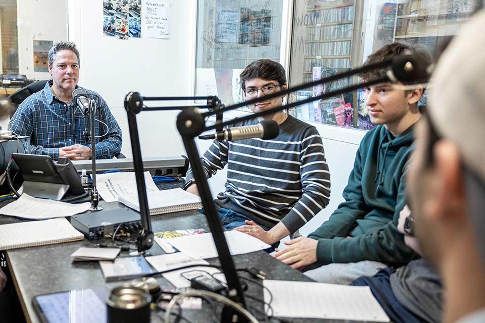 Guy Antebi with students at the radio station