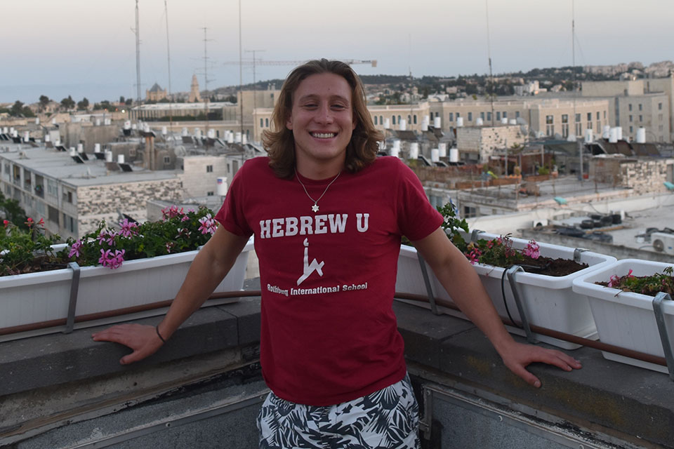 Gabriel Sanders in a red shirt in Jerusalem