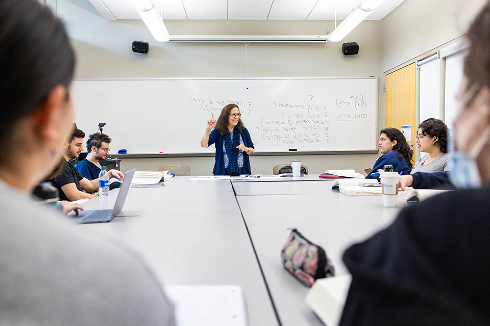 Professor Esther Shorr teaching in a classroom