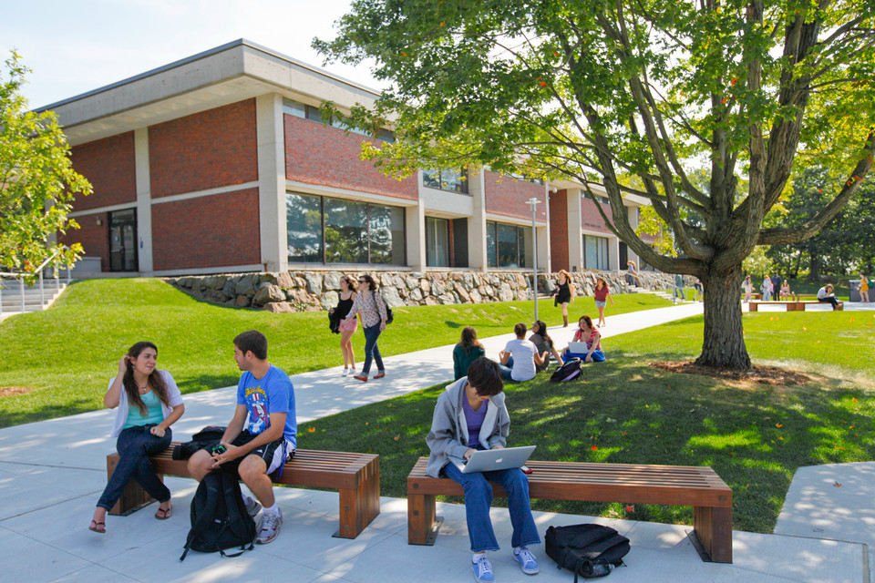 students on benches outside
