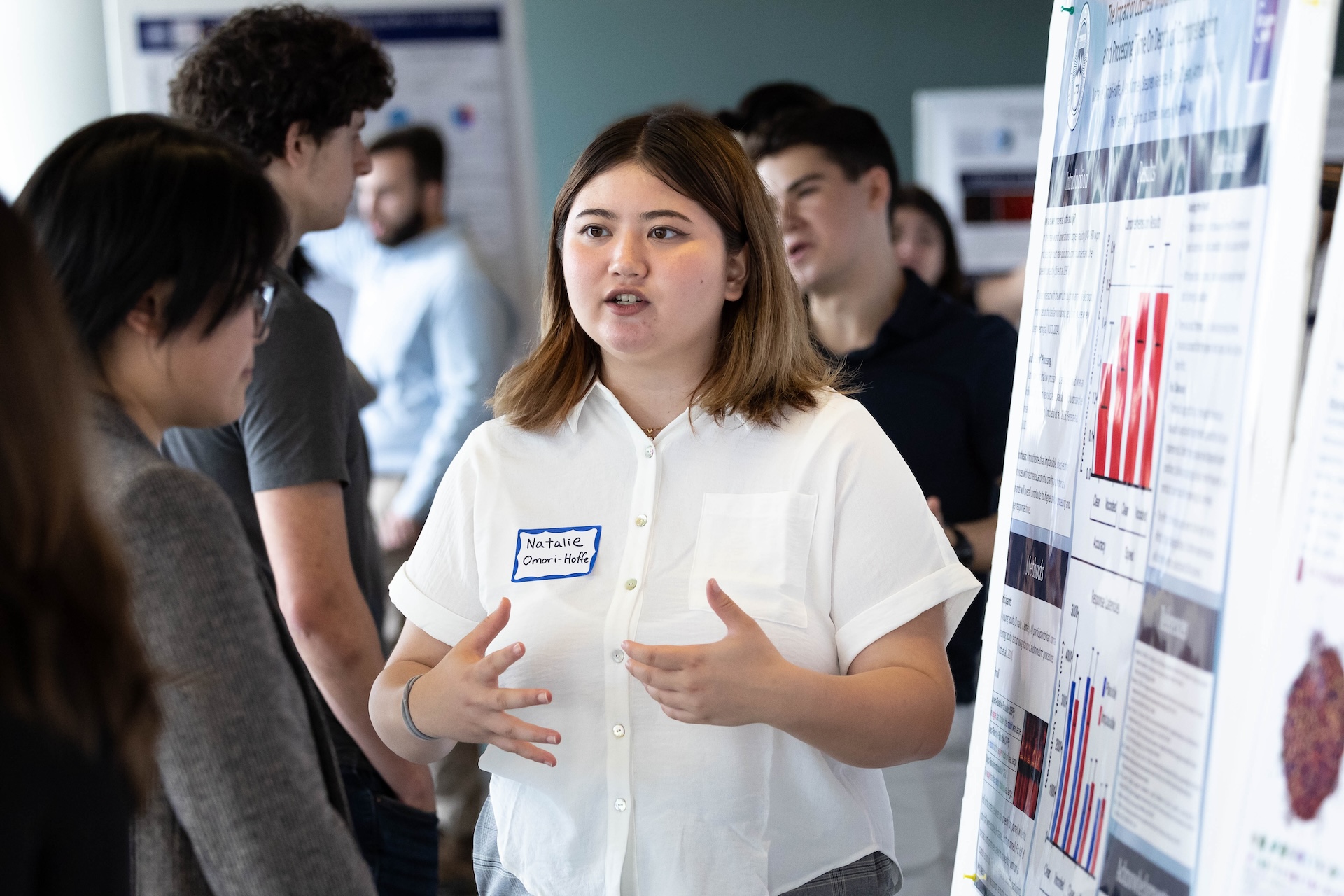 Natalie Omori-Hoffe presents at a poster session