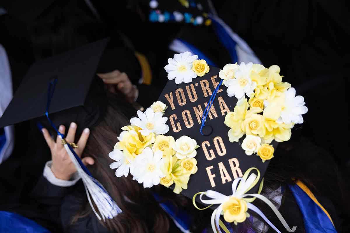 A mortarboard decorated with flowers and the words You're Gonna Go Far