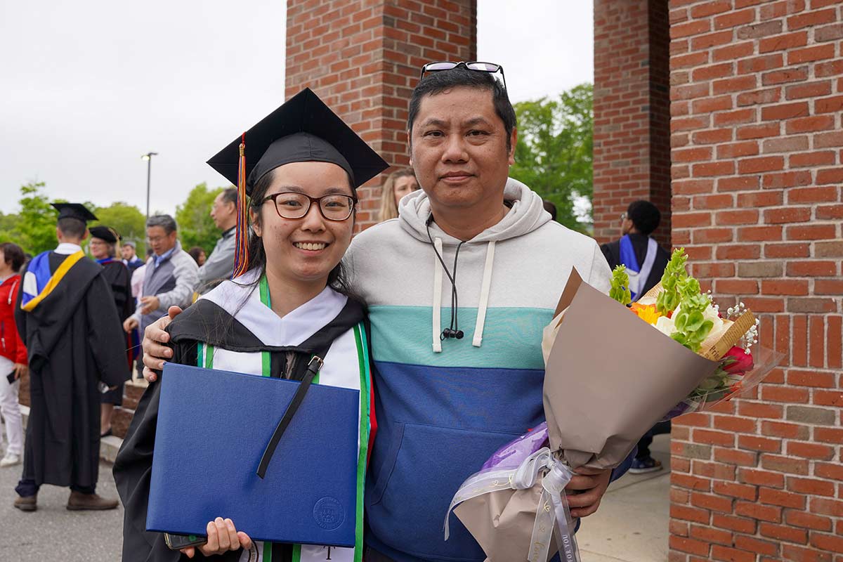 Lang Cheng with her uncle, who is holding flowers