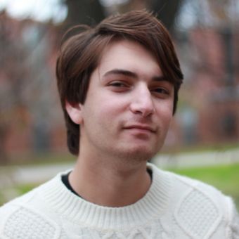 Jason Dickstein looks at the camera for his headshot