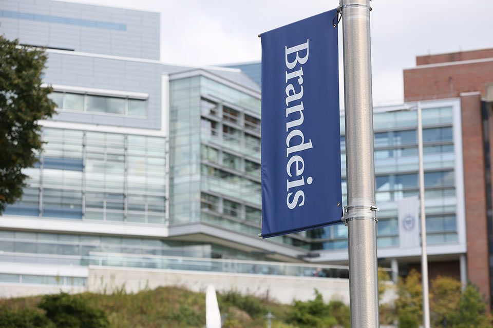 Brandeis banner on campus